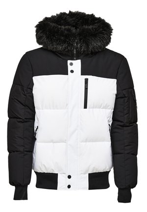 Doudoune rembourrée avec un haut noir et un bas blanc, une capuche doublée de fausse fourrure, des poches zippées et des poignets et ourlet côtelés.