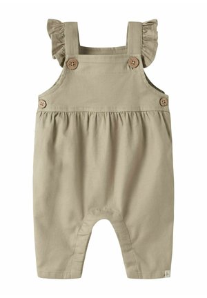 Beige babyoveralls med flæsebesatte skulderremme og fire brune knapper, lavet af blødt stof med detaljeret elastisk talje.