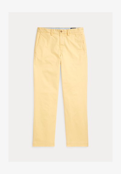Κίτρινο βαμβακερό παντελόνι με ευθεία γραμμή, διαθέτει εμπρόσθιες τσέπες και κλείσιμο με κουμπί. Λείο ύφασμα, καθημερινό σχέδιο, χωρίς ορατά μοτίβα.