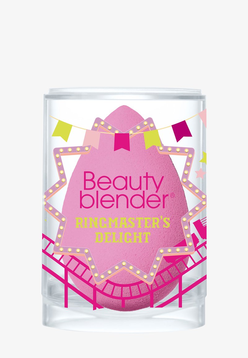 Różowa gąbka Beauty Blender w przezroczystym cylindrycznym pojemniku, ozdobiona kolorowymi flagami i wzorem kolejki górskiej. Tekst brzmi "ROZKOŚNIK ZWIERZĄT".