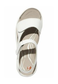 White sandal with dual straps, Velcro closure, and cushioned insole. Features a light beige footbed with subtle wave pattern.