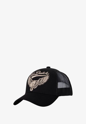 Gorra de camionero negra con paneles laterales de malla. Presenta un gráfico elevado en color crema de la cabeza de un león con alas y el texto "Von Dutch".