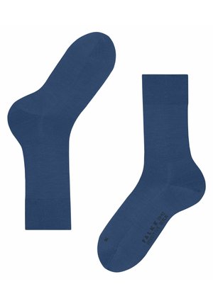 Niebieskie bawełniane skarpetki o gładkiej fakturze, z wzmocnionymi piętami i palcami. Zawierają logo na podeszwie. Standardowy design do kostki.
