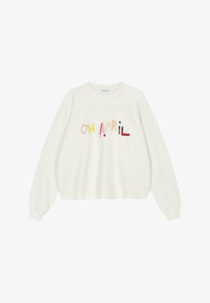 Bijela majica s dugim rukavima s višebojnim vezom na kojem piše "OH APRIL", opuštenog kroja i rebrastim manžetama. Mekana, teksturirana tkanina.