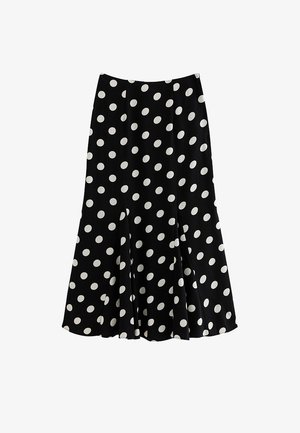Jupe noire mi-longue à pois blancs, ourlet évasé et texture de tissu lisse.