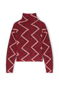 Červený a růžový rolákový svetr s cikcak vzorem, texturovanou tkaninou a dlouhými rukávy. Obsahuje třpytivé akcenty po celém svetru.