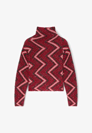Pull à col roulé rouge et rose à motif zigzag, tissu texturé et manches longues. Comprend des accents scintillants partout.