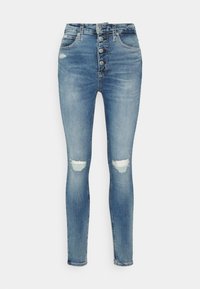 Smala jeans i ljusblå denim, med hög midja, fem knappar i gylfen och slitna hål vid knäna. Slät textur och åtsittande design.