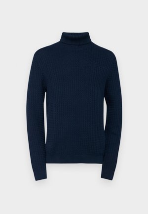 Marineblå turtleneck sweater med et tekstureret mønster, lange ærmer og ribkant ved kraven og ærmerne, lavet af et let strikket materiale.