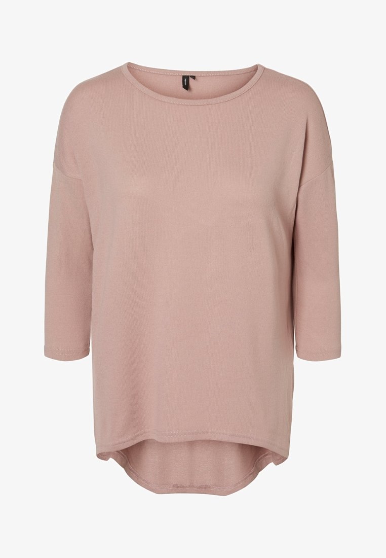 Haut à manches longues rose clair côtelé avec une coupe décontractée, un col arrondi et un ourlet asymétrique. Tissu doux avec une texture subtile.