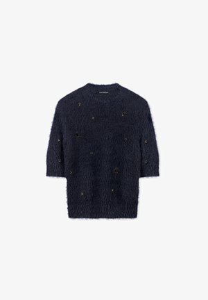Navy blue fuzzy sweater with half sleeves, featuring decorative black beads and varied shapes, creating a textured appearance.
