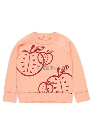 Felpa color pesca con stampa di una mela rossa, collo rotondo e polsini a costine. Presenta il testo che recita: "La Terra ha musica per coloro che ascoltano."