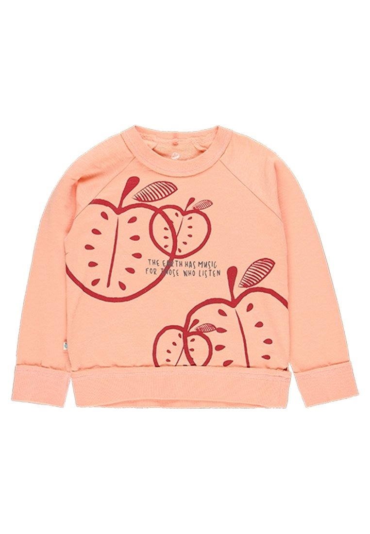 Felpa color pesca con stampa di una mela rossa, collo rotondo e polsini a costine. Presenta il testo che recita: "La Terra ha musica per coloro che ascoltano."