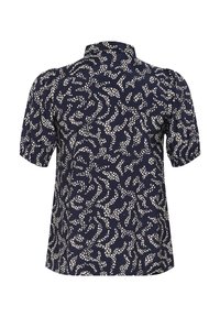 Blouse bleu marine à manches courtes avec motif de points blancs irréguliers, col montant et manches bouffantes plissées, vue de dos.