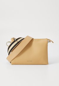Tan leather crossbody bag with black and cream striped shoulder strap. Features silver hardware and a zippered top closure.