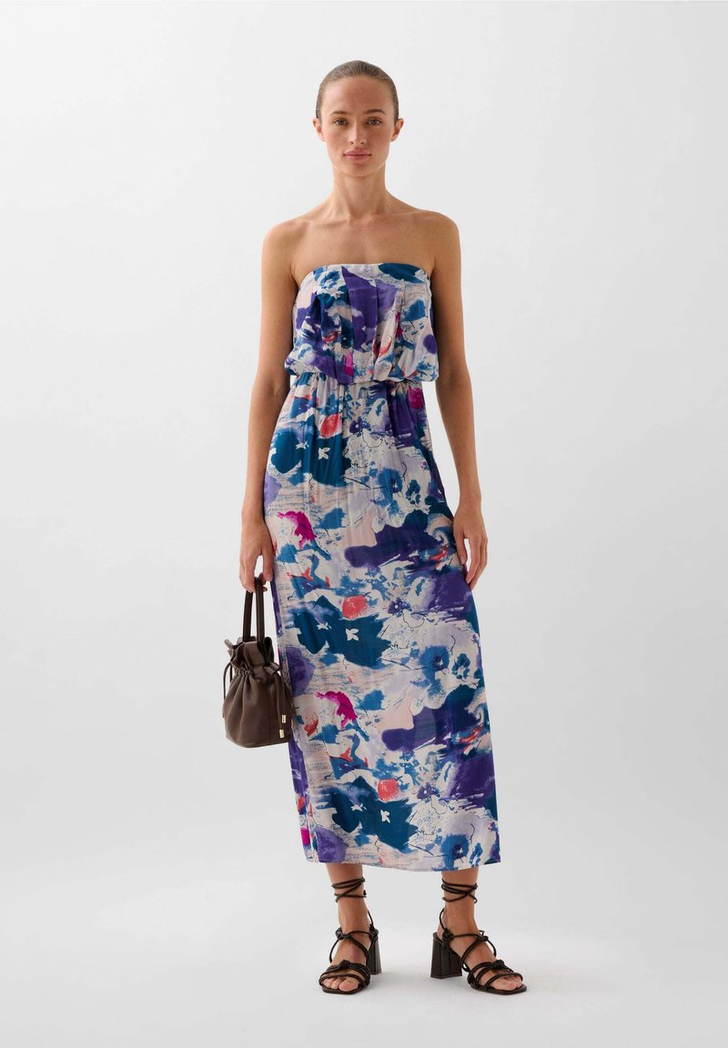 Strapless maxi dress featuring a multicolored floral print in blue, purple, and pink. The fabric is lightweight with a gathered waist.