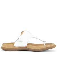 Sandale en cuir blanc à lanières avec une semelle en liège, présentant un design de séparateur d'orteils et des accents de couture minimalistes. Semelle légère et plate.