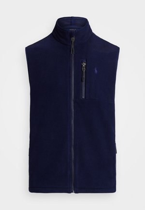 Navy blue fleece vest with high collar, full front zipper, and a zippered pocket on the chest. Features decorative logo on the left.