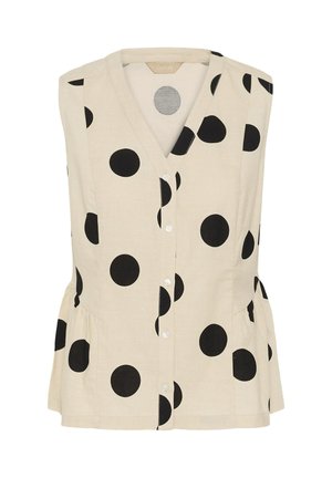 Blouse beige sans manches avec grands pois noirs et col en V.
