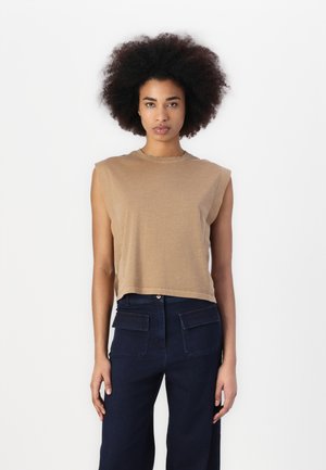 Brown sleeveless top with a crew neckline, made of soft fabric, and paired with dark blue wide-leg pants featuring back pockets.