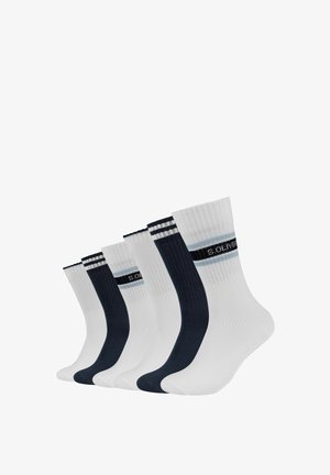 Chaussettes en mélange de coton, de couleur navy et blanche. Elles présentent une texture côtelée et des rayures contrastantes sur le haut avec un détail de marque au centre.