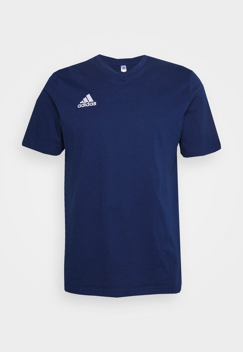 Námořnická modrá bavlněná trička s krátkými rukávy a kulatým výstřihem. Na levé straně hrudi je bílá logo Adidas. Jednoduchý, minimalistický design.