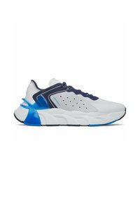 White sneaker with navy accents, textured mesh upper, contrasting blue heel detail, and thick, segmented white sole. Laced design with perforations.