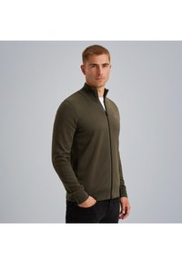 Olivovo zelená bundová mikina na zips vyrobená z textúrovanej látky, s vysokým golierom, bočnými vreckami a rebrovanými manžetami; š slim fit dizajn.