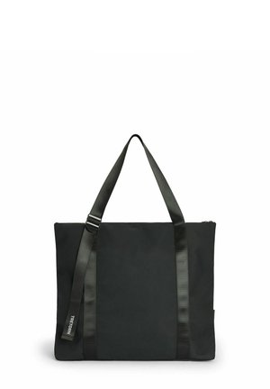 Sort rektangulær tote taske med lange håndtag og en justerbar rem med ”TRETORN”-label mod hvid baggrund.