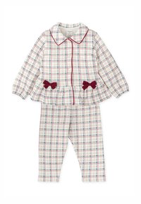 Ensemble de pyjama deux pièces blanc avec un motif à carreaux rouge et bleu, comprenant un haut boutonné avec col et volant, et un pantalon ajusté avec des nœuds.