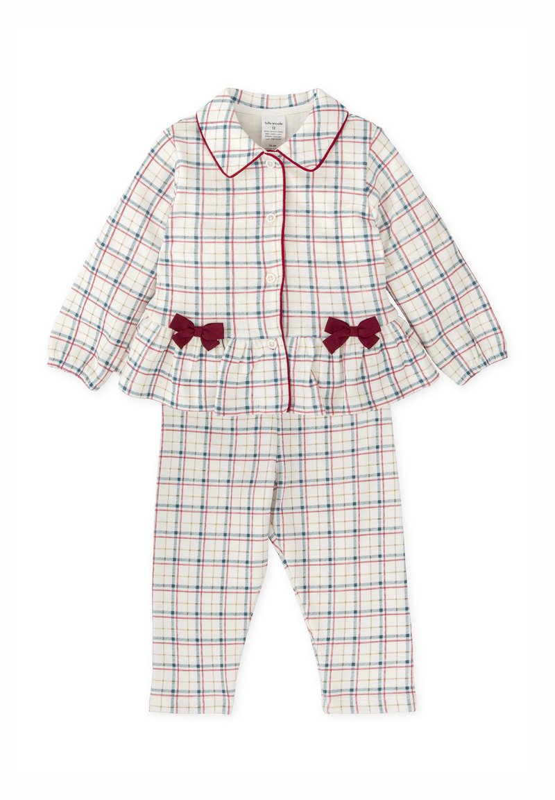 Ensemble de pyjama deux pièces blanc avec un motif à carreaux rouge et bleu, comprenant un haut boutonné avec col et volant, et un pantalon ajusté avec des nœuds.