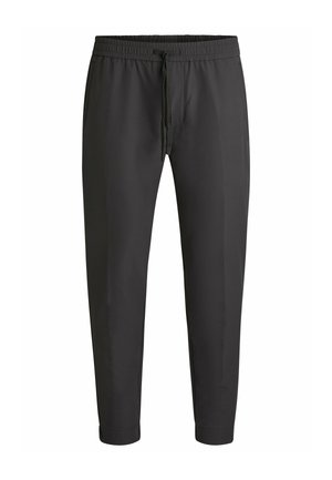 Sorte tapered bukser med elastisk talje og snoretræk. Glat tekstur, ingen synlige mønstre, og manchetter ved anklerne.