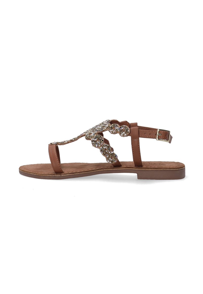 Brune flade sandaler med et slankt stropdesign, prydet med dekorative cirkulære perleaccentuer og en justerbar spænde-lukning ved anklen.