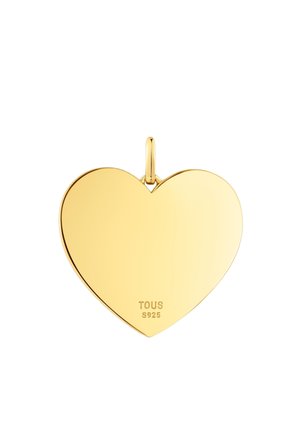 Colgante en forma de corazón de oro con superficie lisa, que presenta un lazo para sujetar, grabado con "TOUS" y "S925" en la parte inferior.