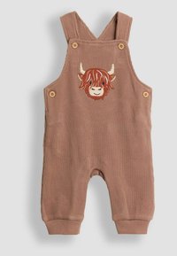Braune Corduroy-Overalls mit gesticktem Gesicht eines Highland-Rinds. Verfügt über zwei Knöpfe an jedem Träger und gerippte Bündchen an den Knöcheln.