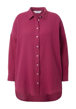 Camicia a maniche lunghe con bottoni di un ricco colore magenta. Realizzata in un tessuto testurizzato con una vestibilità comoda e un orlo arrotondato.