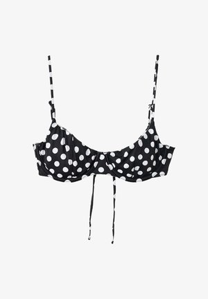 Sutien negru cu buline albe, bretele subțiri reglabile și cupe cu armătură și închidere frontală cu fundă.