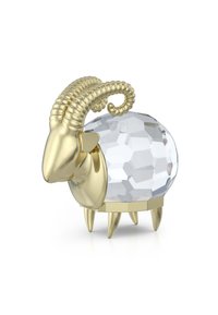 Figurka barana w kolorze złotym z fakturowanymi, spiralnymi rogami oraz fasetowanym, przezroczystym ciałem, wspieraną przez cztery złote nogi.