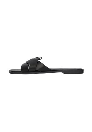 Black flat slide sandal with wide crossed leather straps and an open toe design, shown from the side on a white background.