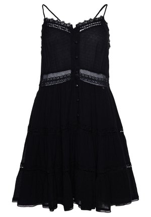 Robe noire sans manches avec fines bretelles, boutons sur le devant, bordure en dentelle le long de l'encolure et de la taille, et jupe à volants avec inserts en dentelle.