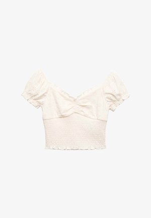 Krótka bluzka w kolorze ecru z krótkimi bufkami, marszczonym biustem, haftowanymi kwiatowymi oczkami i marszczoną talią z falbankowanym dołem.