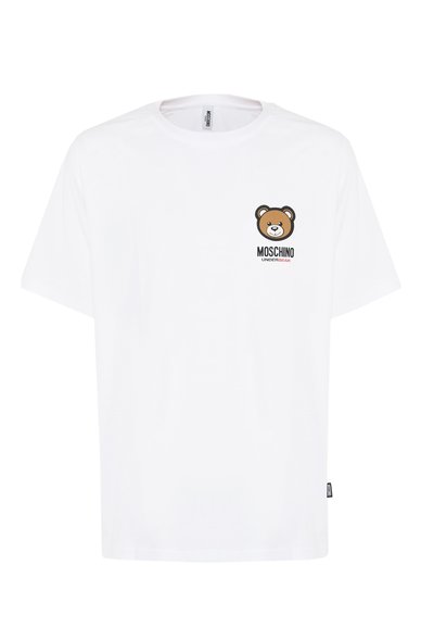 T-shirt bianca in cotone con una grafica stampata di un orso sul lato sinistro del petto e il testo "Moschino" sotto. Vestibilità ampia, maniche corte.