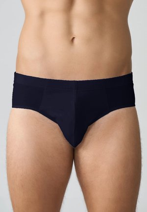 Slip in blu navy da uomo realizzati in tessuto morbido, caratterizzati da una vestibilità aderente, una cintura elastica e un design liscio e senza cuciture con cuciture minime.