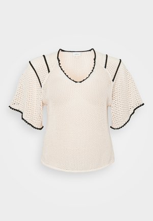 Top en maille crème léger avec un col en V, des bords noirs et des manches courtes évasées. Présente un motif texturé et des bords en scallop.