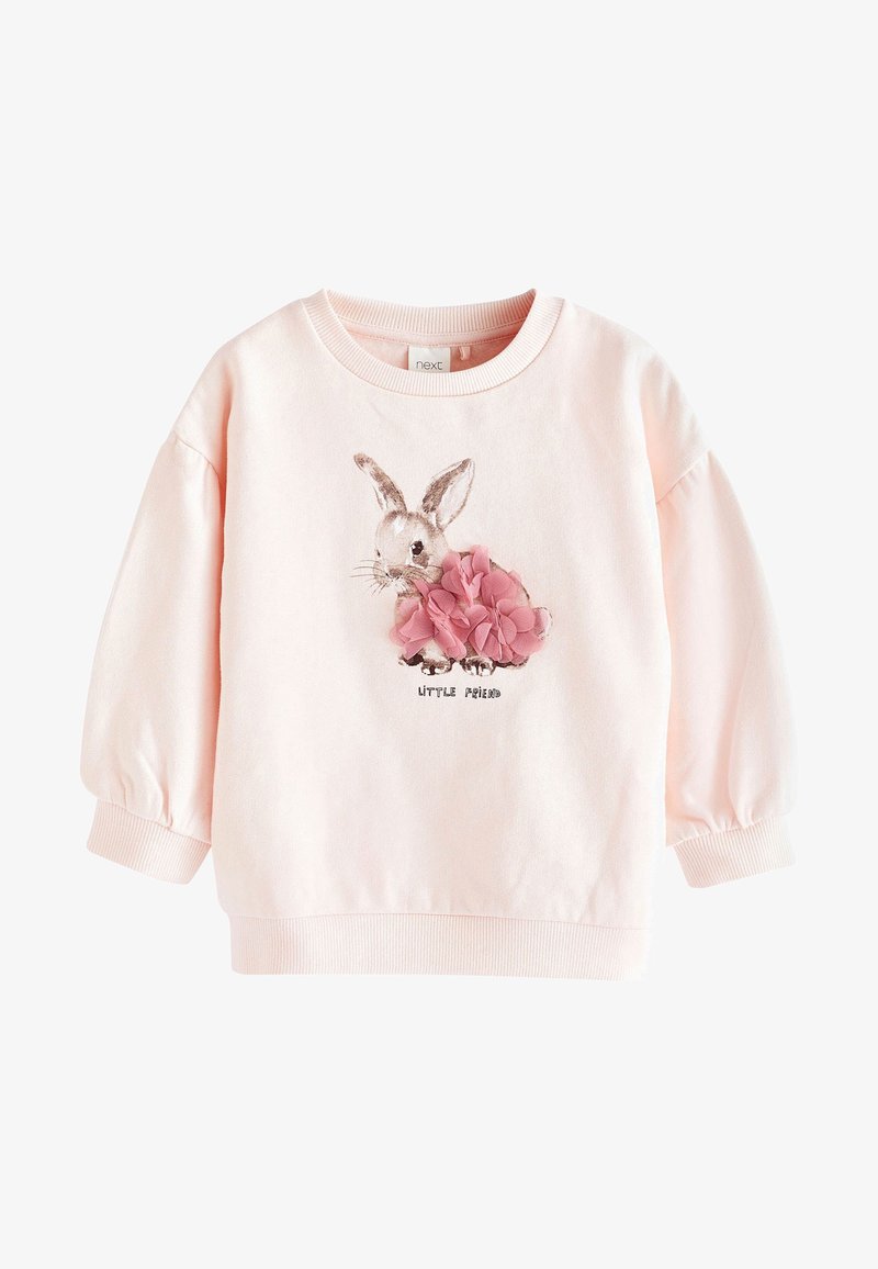 Sweat-shirt à manches longues rose pâle pour tout-petit, avec un dessin de lapin, des accents en tissu fleur rose, et le texte « Petit Ami » sur le devant.