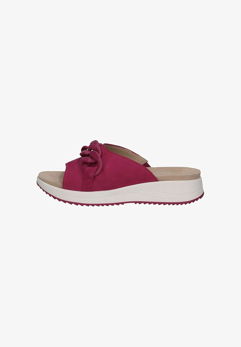 Sandales à glissière fuchsia avec une texture en suede lisse, dotées d'un accent noué et d'une semelle blanche crantée pour l'adhérence et le confort.