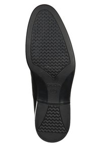 Suola nera in gomma con un motivo a zigzag testurizzato, con logo Geox. Il tacco è arrotondato e la forma complessiva è slanciata.