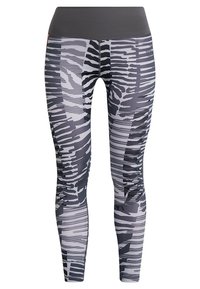 Vysoké legíny v šedé barvě s abstraktními černobílými vzory, vyrobené z hladkého a elastického materiálu s těsným střihem.