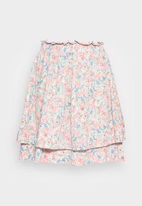 Saia de estampa floral com cores pastel, apresentando uma cintura franzida e uma borda superior em babados. Feita de um tecido leve com um design fluido.