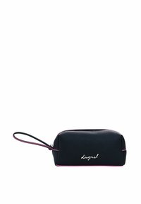 Black zippered cosmetic bag with a textured finish, featuring a pink accent along the zipper and a handwritten "designed" logo.